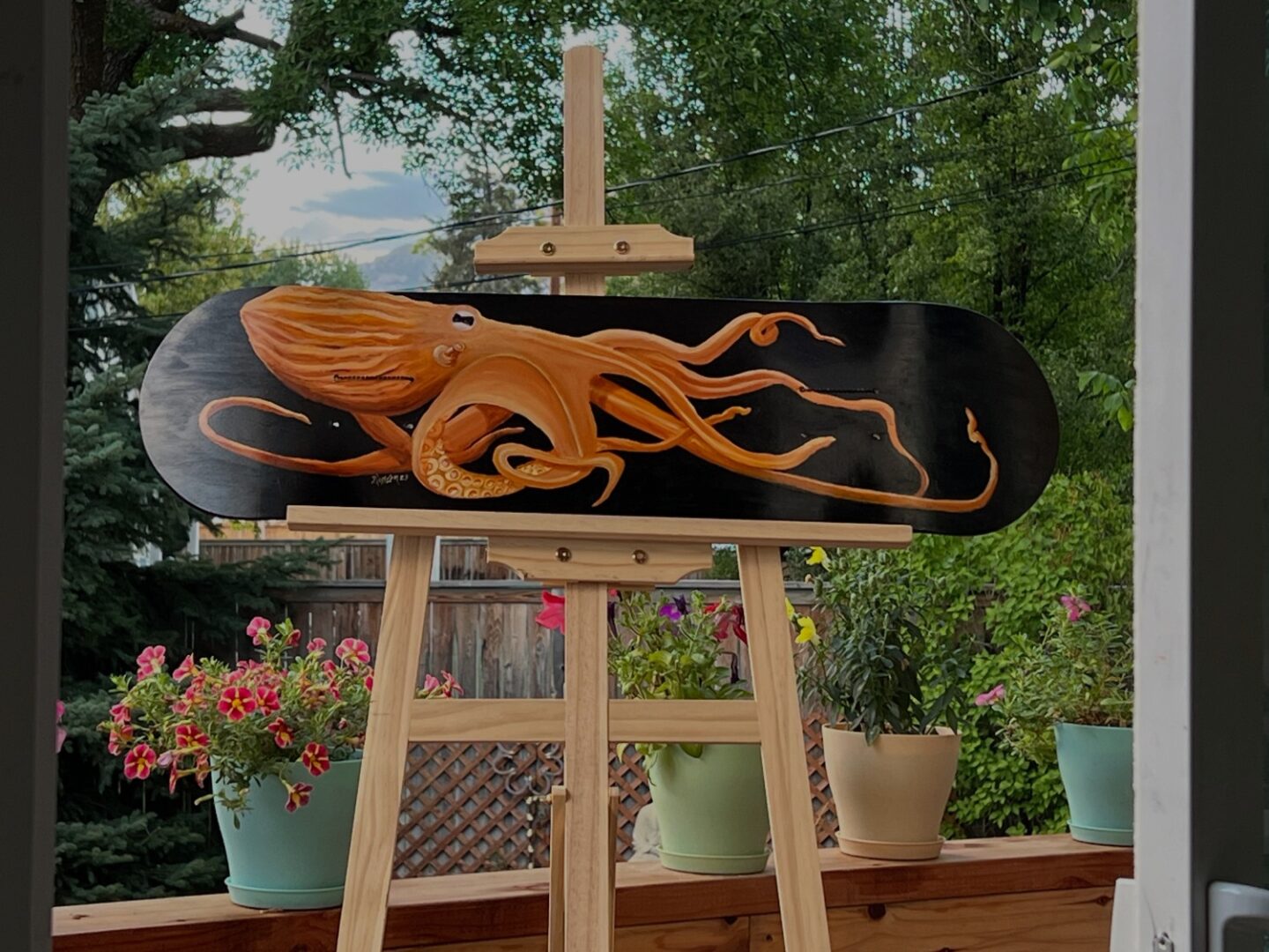 A skateboard with an octopus on it is shown.