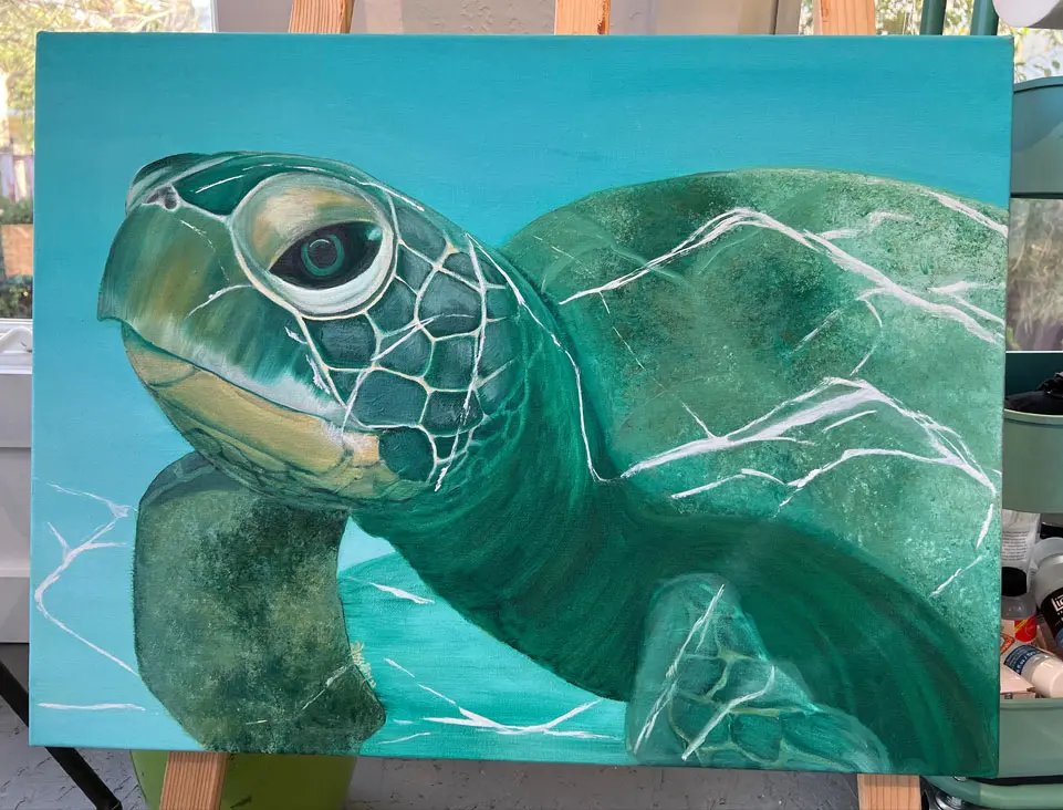 A painting of a turtle in the water